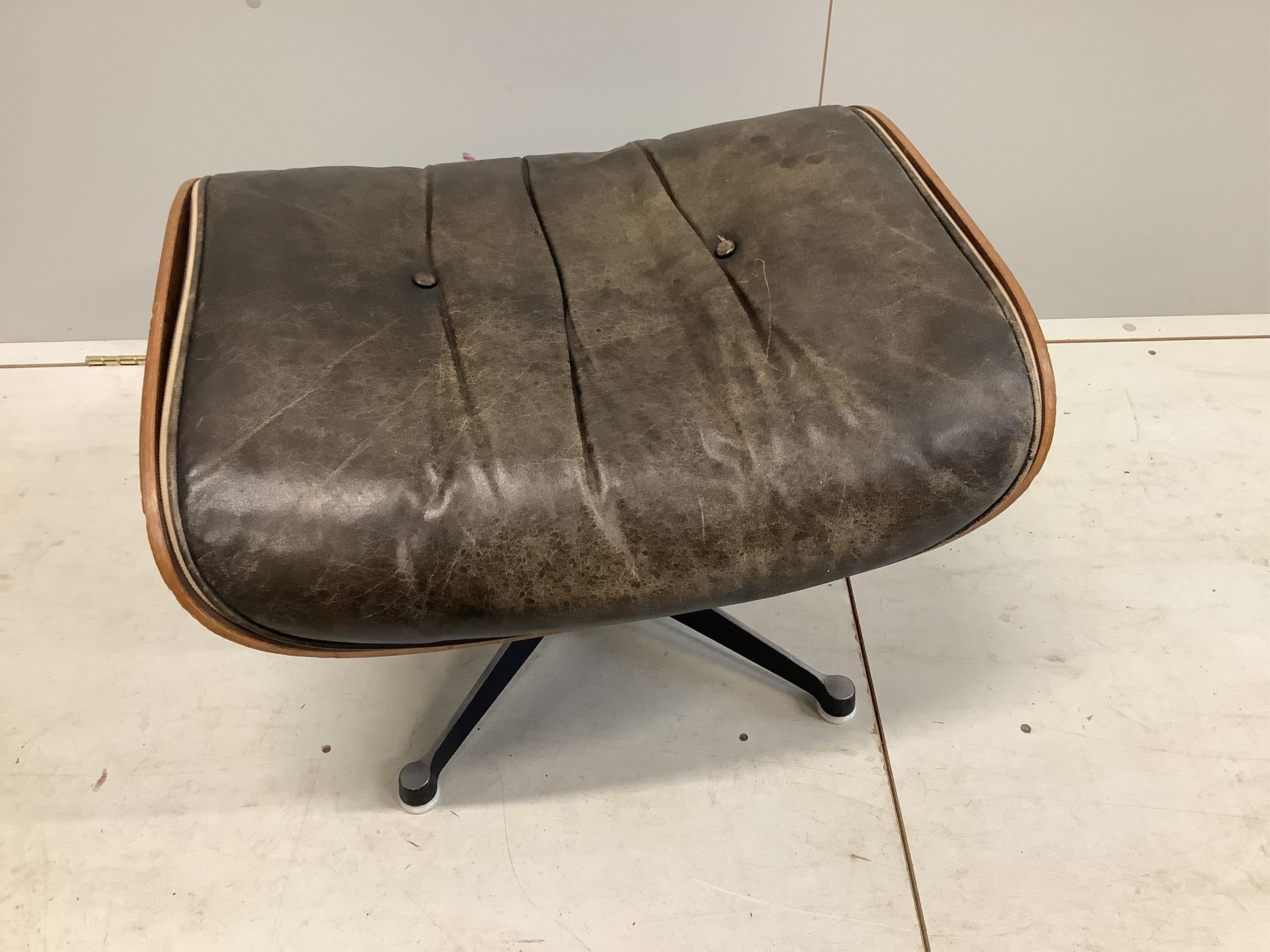 Charles and Ray Eames for Herman Miller Interform, an Indian rosewood and black leather lounge chair and ottoman, circa 1960, chair width 85cm, depth 68cm, height 81cm. Condition - poor to fair